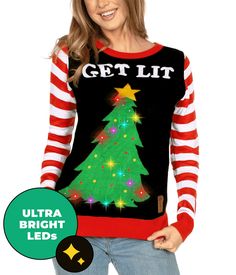 a woman wearing a christmas tree sweater with the words get lit in front of her