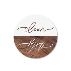 a round sticker with the words clean and happy written in cursive writing