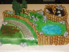 a birthday cake that looks like a zoo scene