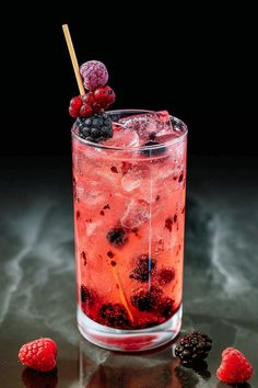 raspberry soda with ice and blackberries on the side, ready to be served