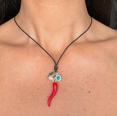 DAILY USE PROTECTION  This Italian cornicello or red cacho necklace is known in Italian culture for being an amulet with protective powers against the evil eye and other negative energies, Handmade in black synthetic leather for greater use and durability. THIS WILL BE THE AMULET YOU WILL ALWAYS WANT TO WEAR 🌶️🧿 SURPRISE YOUR SPECIAL PERSON WITH THIS UNIQUE ACCESSORY THEY WILL LOVE. ❤️🎁 🌶️ Characteristics: Material: Authentic red chub   Italian Cornicello Necklace Length:  46 cm / 18 inch Un Red Charm Necklaces For Good Luck, Red Good Luck Charm Necklaces, Cornicello Necklace, Horn Necklace, Italian Culture, Gift Bows, Red Chili, Special Person, Accessories Unique