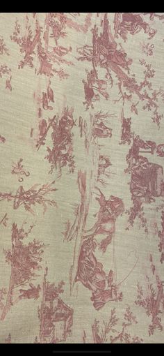 an old wallpaper with pink and white designs on the fabric is shown in this image