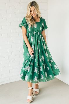 Be the belle of the ball in the Elena Embroidered Bubble Sleeve Dress! With a square neck and playful bubble sleeves, this dress will have you feeling cute and flirty. Perfect for any occasion, dress it up or down for a look that is uniquely you. (Note: Bubble sleeves may cause spontaneous twirling!) 80% Polyester 20% Tencel Square-Neck - Unique Style Straight Hem - Even Fit Unlined - Lightweight, Opaque Mid-Length - Breezy and cool Empire Waist - Bump Friendly! SIZE GUIDE & MEASUREMENTS: Model Modest Floral Print Dress With Puff Sleeves, Cute Puff Sleeve Dress With Ruffles And Square Neck, Cute Square Neck Dress With Gathered Sleeves, Flowy Puff Sleeve Dress With Square Neck For Spring, Flowy Puff Sleeve Dress With Square Neck For Party, Party Dress With Smocked Bodice And Short Sleeves, Flowy Puff Sleeve Dress With Square Neck And Ruffles, Cute Dresses With Gathered Sleeves For Brunch, Spring Dresses With Gathered Flutter Sleeves