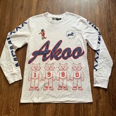 Akoo Flex Long Sleeve White Tee Shirt L Graphic 1980 Front, Back & Sleeve Graphic 60% Cotton 40% Polyester Size Large New With Tags White Tee Shirt, Long Sleeve Men, White Long Sleeve Tee, White Tee Shirts, Streetwear Mens, Sleeve Men, Branded Shirts, Mens Crew Neck, Nike Shirts