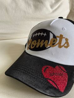 Show your support for your favorite football player or players with this super cute custom trucker hat. Can customize with a variety of colors for the team name and in the heart. Choose the team name color as the primary color and the heart color as the secondary color. Game Day Trucker Hat With Letter Print, Game Day White Trucker Baseball Cap, White Trucker Baseball Cap For Game Day, Team-colored Trucker Hat With Letter Print For Game Day, Game Day Team-colored Trucker Hat With Letter Print, Customizable Baseball Cap Trucker Hat For Game Day, Customizable Trucker Hat For Game Day, Customizable Snapback Trucker Hat For Game Day, Customizable Baseball Cap For Game Day