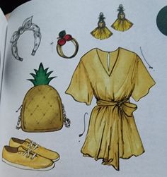 an open book with drawings of clothes and accessories on the pages, including shoes, bracelets, ring, and pineapple