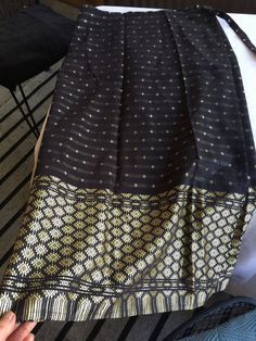 Exotic Black and Gold silk wrap-around skirt, darted for a slim fit (as shown in the last photos). The skirt wraps around and ties the waist. The width of the entire skirt flat is about 61" around, and you can adjust how slim you want it by overlapping more or less of it and using the waist ties to tighten to your size. It's about 31" from waist to hem. Please take a look at my storefront at: https://www.etsy.com/shop/FabFinds42?ref=seller-platform-mcnav I have a wide selection of one-of-a-kind Traditional Harem Skirt For Festivals, Elegant Long Skirt For Festivals, Traditional Long Black Skirt, Traditional Black Long Skirt, Traditional Fitted Long Wrap Skirt, Fitted Traditional Long Wrap Skirt, Festive Black Bottoms, Traditional Skirt With Woven Motifs, Traditional Lined Maxi Skirt For Festivals