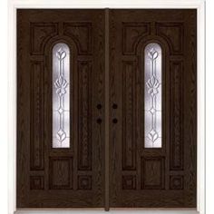 a double door with two sidelights and glass panels on the top, in dark wood