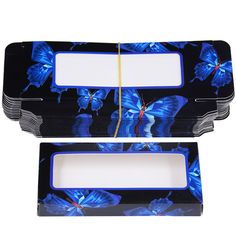 two blue butterflies on black and white serving trays