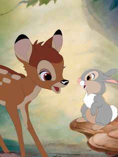 the little deer and the rabbit are standing next to each other