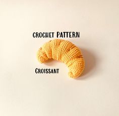 a crochet pattern for a small yellow caterpillar on a white surface