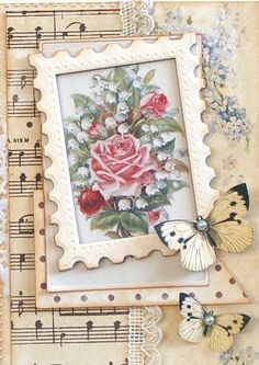 some butterflies are flying around a stamp with flowers and roses on it's side