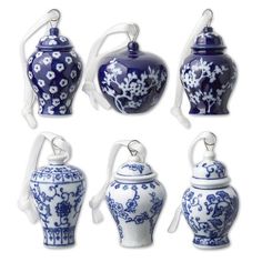 six blue and white vases with handles on each one, all decorated in floral designs