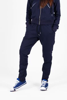 This stylish tracksuit features a zip-up hoodie with two side pockets, offering both comfort and practicality. The matching harem-style pants come with decorative stitching, an elastic waistband, and a relaxed fit, providing a trendy yet comfortable look. Designed with a modern aesthetic, this set is versatile enough to wear together as a coordinated outfit or separately for different styling options. Perfect for those who appreciate designer pieces with a unique and fashionable edge Two pieces set, outfit in two parts. Zipper top and harem pants. Made of Cotton elastin Suitable for maxi sizes. The model wears size M - 5,6' / 170 cm. The model can be customized by size given from the client. Black Cotton Stretch Tracksuit, Winter Moisture-wicking Black Tracksuit, Black Stretch Sporty Tracksuit, Navy Sporty Long Sleeve Tracksuit, Black Long Sleeve Sporty Tracksuit, Stylish Pants, Chic Design, Casual Wardrobe, Stylish Women