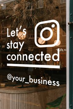 a sign that says, let's stay connected @ your business on the window