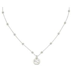 Gucci Interlocking G Sterling Silver Pendant Necklace YBB479221001 The interlocking G has remained one of the most symbolic codes of the House since its introduction. The distinguishing emblem is made in 925 sterling silver and hangs from a boule chain enriched with flower motifs. This item will arrive beautifully packaged in a unique Gucci presentation box. Flower Motifs, Sterling Silver Necklace Pendants, Silver Pendant Necklace, Sterling Silver Pendant, Sterling Silver Pendants, Silver Pendant, The House, Jewelry Necklace Pendant, Jewelry Necklaces