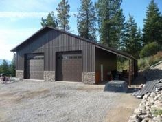 two garages are shown next to each other in front of some trees and mountains