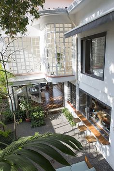 an aerial view of a house from the top floor, looking down on it's patio