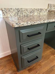 an image of a kitchen counter top with drawers on the bottom and marbled tops