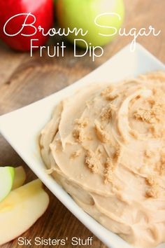 a white plate topped with fruit dip next to sliced apples