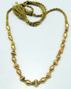 vintage 22 K gold beads necklace, handmade piece individually knotted, One fluted bead followed by tube beads. Total weight-39 grams, Length-32 cm(end to end gold beads only)fully adjustable by moving thread knot. Material-22 ct gold beads with wax inside. Gold Necklaces With Large Beads For Wedding, Gold Beaded Necklaces With Large Beads For Celebration, Gold Beaded Necklace With Large Beads For Festive Occasion, Vintage Gold Beads For Festive Occasions, Gold Beaded Necklace With Large Beads For Celebration, Festive Vintage Gold Beads, Hand-strung Gold Beads For Wedding, Hand-strung Gold Necklaces For Weddings, Gold Dangling Beads For Festivals