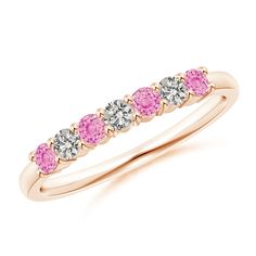 Pleasing pink sapphires and diamonds adorn the glistening band in a half eternity. They are held in a prong setting and arranged in an alternating pattern. This 7 stone pink sapphire and diamond band is crafted in 14k rose gold. Pink Half Eternity Diamond Band, Pink Diamond Half Eternity Band, Pink Half Eternity Diamond Ring, Pink Eternity Band With Prong Setting As Promise Ring, Pink Half Eternity Round Band, Pink Half Eternity Ring With Round Cut, Pink Diamond Eternity Band For Anniversary, Pink Round Cut Eternity Band Promise Ring, Pink Eternity Band With Prong Setting