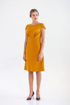 "A midi mustard dress featuring a line silhouette, draped bodice and cap sleeves. - draped bodice - a line silhouette - cap sleeves - scoop neck - knee length (midi) - two pockets in side seams - premium italian fabric Color: yellow (mustard) Fiber: viscose - 60%, elastan - 5%, polyester - 35% Concealed back zipper closure For Size S (6 US): dress length - 39\" (101,5 cm) Our model wears size S (US 6) and is 171 cm/5'6\" tall. You may feel free choosing the size. Just send us your measurements ( Yellow Draped Ruched Dress, Yellow Draped Dress With Ruched Details, Yellow Elegant Dress With Pleated Bodice, Party Midi Dress With Pleated Back And Short Sleeves, A-line Midi Dress With Pleated Back, Gold Fitted Draped Dress, Fitted A-line Midi Dress With Draped Sleeves, Gold Fitted A-line Midi Dress, Yellow Short Sleeve Dress For Formal Events