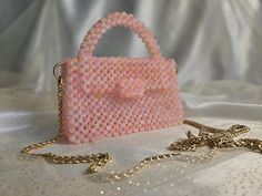 Handmade Candy Pink Beaded Bag with Golden-Toned Hardware This elegant handbag, crafted from pink blush beads, features golden-toned hardware and a 47-inch removable chain. The magnetic closure adds convenience and ease of use. Our bags are 100% handmade. Each bag is unique and crafted with love for our customers. It takes 3-5 days to create one bag. A perfect gift for women, friend, family member or loved one. Ideal for any celebration, event, wedding or birthday party. This unique and distinct Chic Pink Beaded Shoulder Bag, Pink Beaded Rectangular Clutch, Pink Clutch With Chain Strap For Gift, Pink Clutch With Chain Strap As Gift, Pink Rectangular Beaded Clutch, Pink Crossbody Evening Bag As Gift, Rectangular Pink Beaded Clutch, Pink Beaded Formal Bags, Formal Pink Beaded Bags