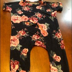 Black Floral One Piece Handmade By Little Rangos. Super Soft And Stretchy. Never Worn. But Did Wash When I Received It. Hung To Dry. Casual Black Onesie For Playtime, Black Summer Onesie For Playtime, Black Short Sleeve Onesie For Summer, Black Cotton Onesie For Spring, Spring Cotton Black Onesie, Spring Black Cotton Onesie, Black Short Sleeve Onesie For Playwear, Fitted Black Onesie For Summer, Cute Black Short Sleeve Onesie