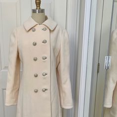 Gorgeous And Heavy! This Vintage Coat Is In Excellent Condition. It Has All Buttons And Hooks, And Lining Is Intact. It Fits A Size 2-4. It Is Floor Length, Very Dressy! Feminine Winter Outerwear With Button Closure, Fitted White Outerwear With Covered Buttons, Fitted Beige Outerwear With Buttons, Feminine Fitted Winter Outerwear, Fitted Feminine Outerwear With Buttons, Feminine Fitted Outerwear With Buttons, Beige Wedding Outerwear With Buttons, Fitted Cream Outerwear With Buttons, Vintage Wedding Outerwear With Buttons