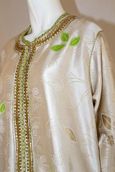 For Sale on 1stDibs - Elegant Moroccan caftan silk gold damask gorgeous vintage hostess gown. Light green floral leaf design on silk Kaftan circa 1970s. Exotic oriental long Elegant Green Thobe For Festive Occasions, Green Long Thobe For Wedding, Green Formal Kaftan For Eid, Traditional Green Maxi Dress For Evening, Green Long Sleeve Kaftan For Evening, Elegant Green Festive Thobe, Elegant Green Embroidered Thobe, Eid Embellished Silk Kaftan, Elegant Green Floor-length Thobe