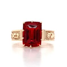 Vintage 10K Rose Gold Red Emerald Cut Synthetic Garnet Carved Band Ring Size 4.5 2.1 Grams Size 4.5 9.0mm x 6.5mm Size of Emerald Cut Red Synthetic Garnet as Center Stone 4.0mm Band Width This Vintage 10K Rose Gold Red Emerald Cut Synthetic Garnet Carved Band Ring,  a captivating blend of elegance and antiquity. Crafted in warm 10K Rose Gold, this  ring features an exquisite Emerald-cut Synthetic Garnet as its centerpiece. The deep  red hue of the garnet evokes passion and sophistication, while the intricate carvings  on the band add a touch of vintage charm. Whether worn as a statement piece or a  cherished heirloom, this ring is sure to enchant and delight. If you have any questions  or concerns, please do not hesitate to ask! Classic Red 14k Rose Gold Jewelry, Classic Red Jewelry In 14k Rose Gold, Red 14k Rose Gold Rings For Anniversary, Pretty Engagement Rings, Jewelry Accessories Ideas, Accessories Ideas, Deep Red, Emerald Cut, Vintage Charms