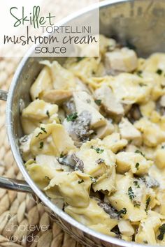 a silver pan filled with pasta and mushrooms