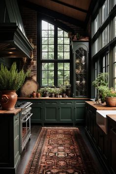 a kitchen filled with lots of green cabinetry and counter top space next to a window