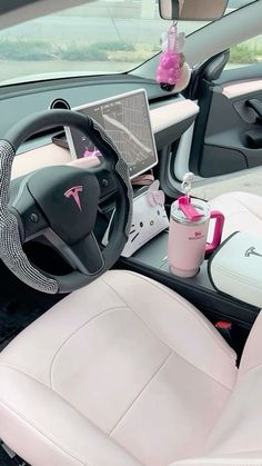 the interior of a car with various items in it