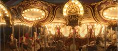 an old fashioned merry go round with lights