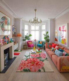 a living room filled with furniture and a chandelier