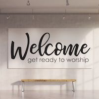 there is a sign that says welcome get ready to worship on the wall in this room