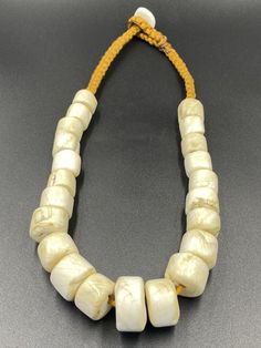 Old ancient African shell beaded necklace Traditional Cream Necklace As A Gift, Ceremonial White Necklaces With Round Beads, Traditional Round Beads Jewelry For Beach, Traditional Round Bead Jewelry For The Beach, Traditional Beach Jewelry With Round Beads, Traditional Round Beaded Jewelry For The Beach, White Round Bead Necklaces For Ceremonial Occasion, Traditional Cream Necklace For Gift, White Round Beads Necklaces For Ceremonial Occasion