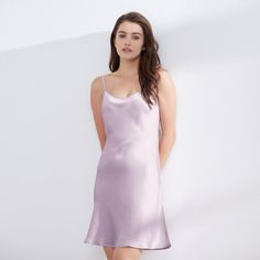 This 19 Momme silk chemise slip dress features adjustable shoulder straps and an above-the-knee length that accentuates your curves while allowing easy movement. Made of 100% Mulberry silk, the slip dress's smooth and silky texture glides over your body, providing a comfortable and effortless fit. The lightweight and breathable nature of silk makes it an ideal choice for warm nights, keeping you cool and comfortable as you sleep. Sizes are available from XS to XXL, with 7 color options to choose Elegant Chemise With Built-in Bra And Spaghetti Straps, Sleek Slip Dress With Spaghetti Straps And Built-in Bra, Sleek Satin Dress With Spaghetti Straps, Elegant Satin Camisole Slip Dress, Elegant Satin Slip Dress For Sleep, Sleek Summer Slip Dress With Built-in Bra, Feminine Silk Slip Dress For Sleep, Feminine Silk Slip Dress For Daywear, Spring Silk Slip Dress With Built-in Bra