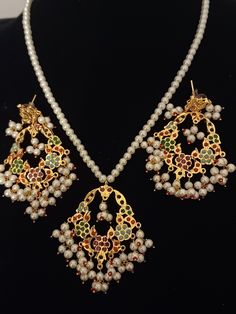 Traditional Beautiful  handcrafted Jadau  designer pendent set in semi precious pearls and stones  ◾22 carat gold plated  ◾ Repolishable Jewellery ◾Next to real jewellery ◾copper based jewellery Handmade White Kundan Pendant Necklace, Traditional Pearl Drop Pendant Jewelry, Traditional Pearl Pendant Jewelry Sets As Gift, White Pendant Temple Jewelry Sets, White Temple Jewelry Pendant Set, White Temple Jewelry Sets With Pendant, Traditional White Jewelry Set With Pearl Pendant, Traditional Kundan Necklace With Pearl Drop As Gift, Traditional Kundan Necklace With Pearl Pendant As Gift