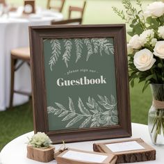 there is a sign that says guestbook on the table