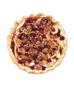 an apple pie with cranberries and granola toppings is shown in this recipe