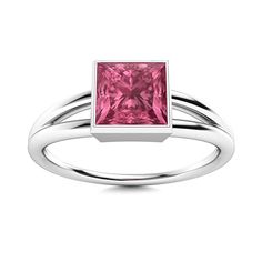 a ring with a pink cubic stone in the center and two thin bands around it