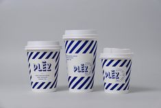 three coffee cups sitting next to each other