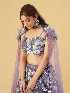 This Lehenga Choli is Ready to Wear Elevate your style with our Lavender Net Embellished Sequin Threadwork Floral Lehenga Set. This set features delicate sequin threadwork and intricate floral designs, making it a perfect choice for any special occasion. Crafted from high-quality net fabric, this lehenga set is both comfortable and stylish. Color Lavender Fabric Net Occasion Party Wear Wedding Wear Style Lehenga Choli Work Embroidery, Sequins Work Chest 38 Lehenga Length 45 NOTE - Originally sti Purple Party Wear Sets With Unstitched Blouse, Purple Choli For Eid Party, Purple Party Choli For Eid, Party Wear Purple Sets With Unstitched Blouse, Purple Party Wear Set With Dupatta, Party Wear Net Set With Unstitched Blouse, Purple Party Choli With Zari Work, Party Wear Sets With Unstitched Blouse, Party Choli With Resham Embroidery In Purple