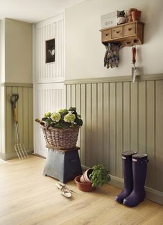 an image of a room with flowers and gardening tools on the floor in front of it