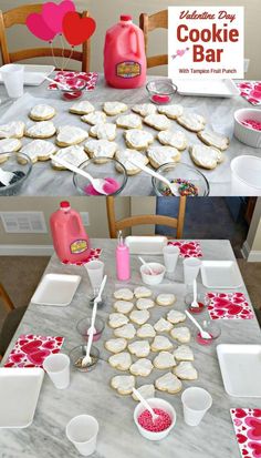 the table is set up with cookies and other desserts for valentine's day