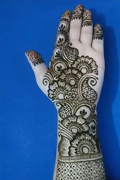 the hand is decorated with intricate designs