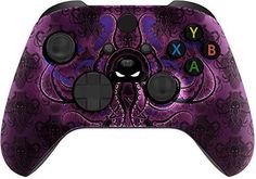 a purple controller with black buttons and letters on the front, in an intricate pattern